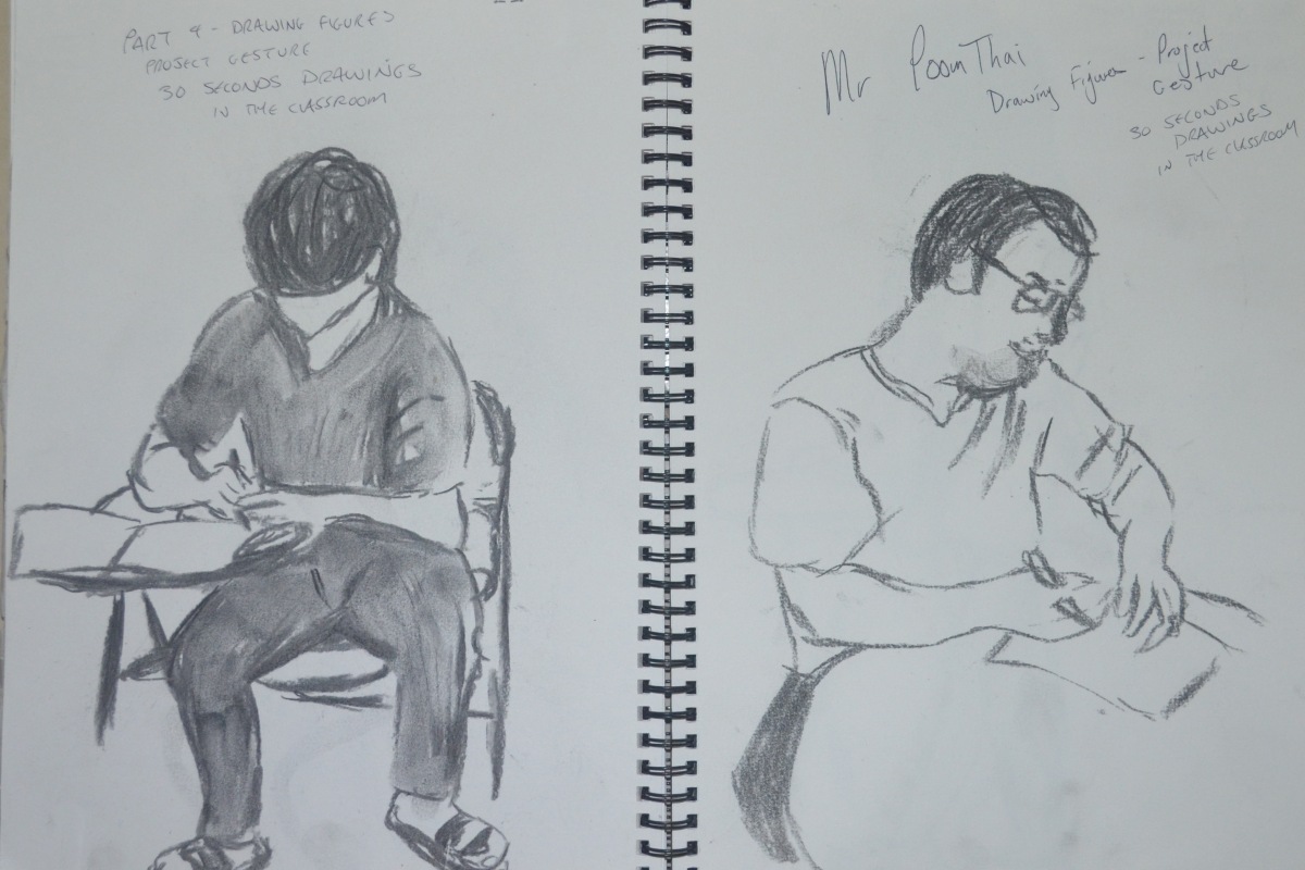 1 - Students Writing in Charcoal
